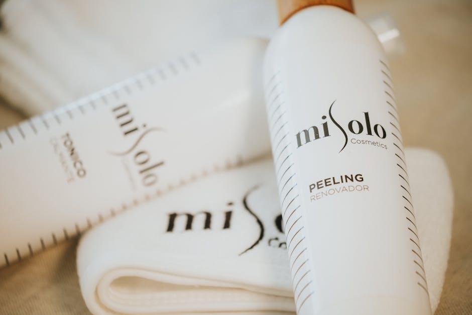 Adelaide skin clinic applying chemical peel solution to patient face during consultation